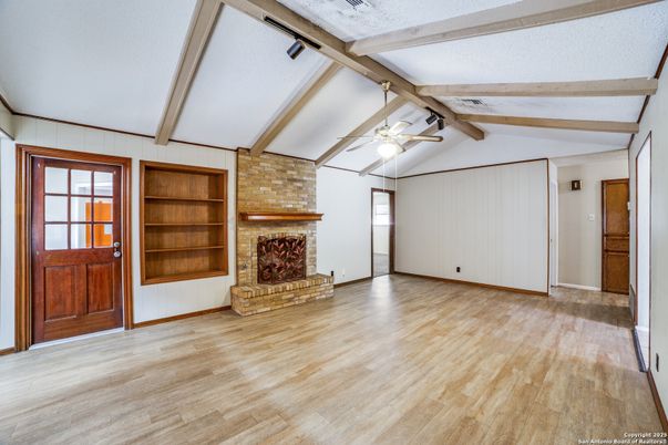 Empty room, Fireplace, Interior, Stone Walls, Wooden Beams, Wood Texture Flooring