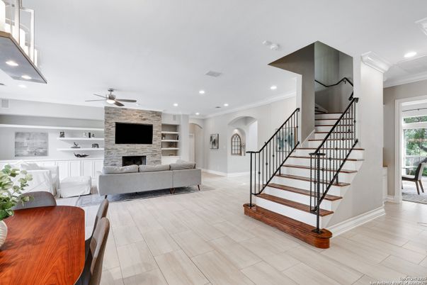 Fireplace, Interior, Living room, Recessed Lighting, Stone Walls, Wood Texture Flooring