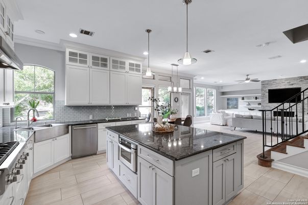 Dining room, Interior, Kitchen, Pendant Lights, Recessed Lighting, Stainless Steel Appliances, Stone Walls, Wood Texture Flooring