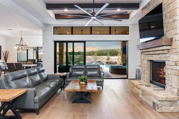 Dining room, Fireplace, Interior, Living room, Pendant Lights, Recessed Lighting, Stone Walls, Wood Texture Flooring
