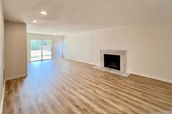 Empty room, Fireplace, Interior, Recessed Lighting, Wood Texture Flooring