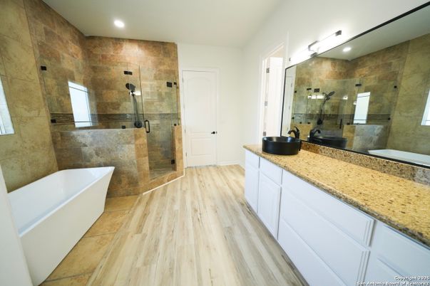 Bathroom, Dual Sink Vanities, Free Standing Baths, Glass Shower, Interior, Recessed Lighting, Wood Texture Flooring
