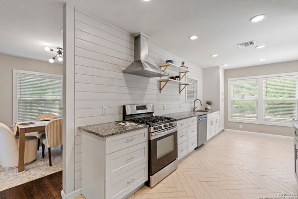 Dining room, Interior, Kitchen, Recessed Lighting, Stainless Steel Appliances, Wood Texture Flooring