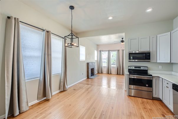 Interior, Kitchen, Pendant Lights, Recessed Lighting, Stainless Steel Appliances, Wood Texture Flooring