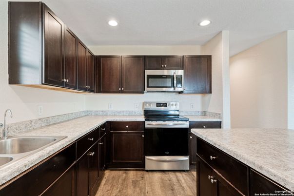 Interior, Kitchen, Recessed Lighting, Stainless Steel Appliances, Wood Texture Flooring