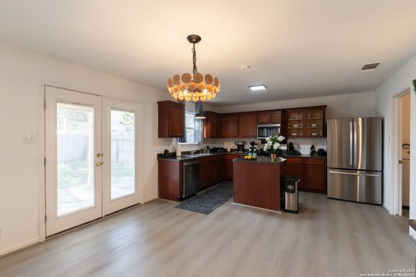 Chandelier, Interior, Kitchen, Pendant Lights, Recessed Lighting, Stainless Steel Appliances, Wood Texture Flooring