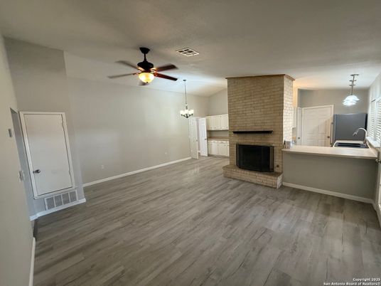 Empty room, Fireplace, Interior, Pendant Lights, Stone Walls, Wood Texture Flooring