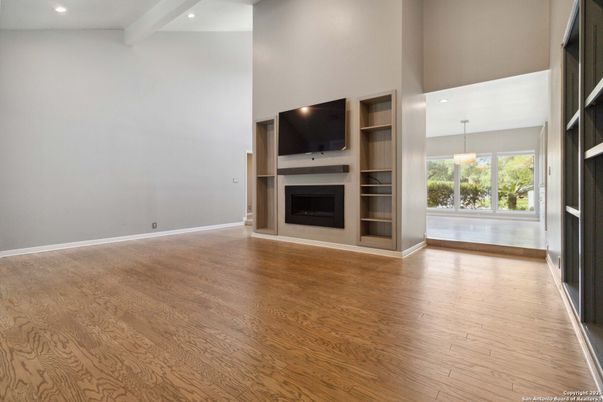 Empty room, Fireplace, Interior, Pendant Lights, Recessed Lighting, Wood Texture Flooring