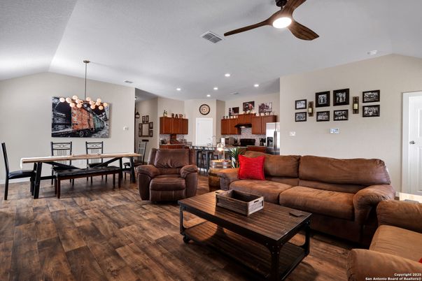 Chandelier, Dining room, Interior, Kitchen, Living room, Recessed Lighting, Stainless Steel Appliances, Wood Texture Flooring