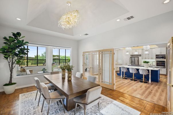 Chandelier, Dining room, Interior, Kitchen, Recessed Lighting, Stainless Steel Appliances, Wood Texture Flooring