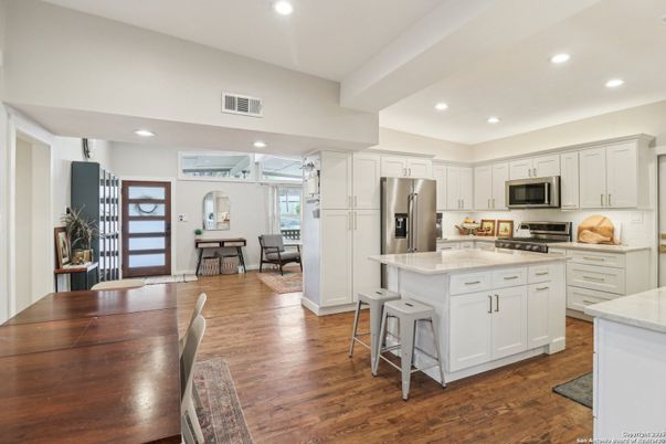Dining room, Interior, Kitchen, Recessed Lighting, Stainless Steel Appliances, Wood Texture Flooring