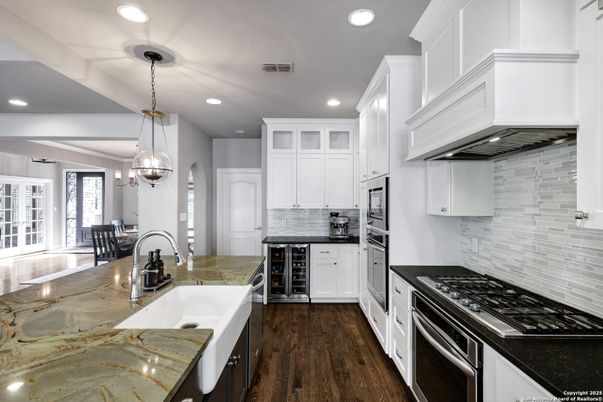 Chandelier, Interior, Kitchen, Pendant Lights, Recessed Lighting, Stainless Steel Appliances, Wood Texture Flooring