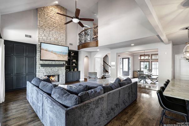 Chandelier, Dining room, Fireplace, Interior, Living room, Pendant Lights, Recessed Lighting, Stone Walls, Wood Texture Flooring