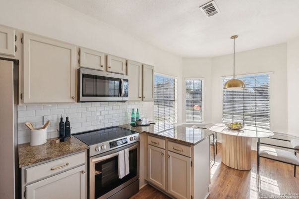 Dining room, Interior, Kitchen, Pendant Lights, Stainless Steel Appliances, Wood Texture Flooring