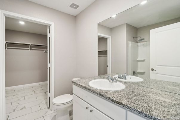 Bathroom, Dual Sink Vanities, Interior, Marble, Recessed Lighting, Walk-in Closets