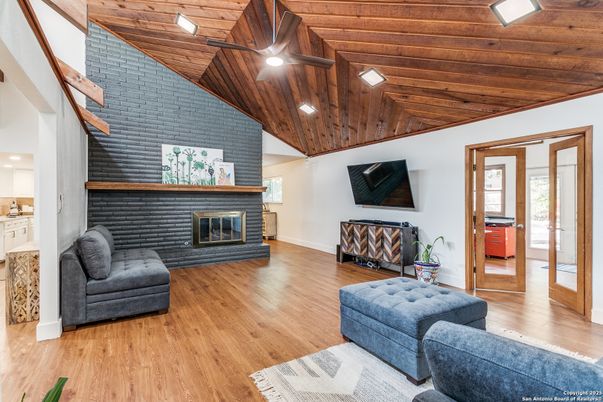 Fireplace, Interior, Living room, Recessed Lighting, Stone Walls, Wooden Ceilings, Wood Texture Flooring