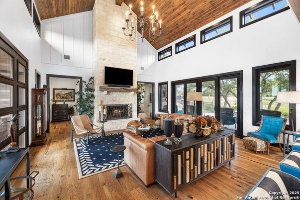 Chandelier, Fireplace, Interior, Living room, Stone Walls, Wooden Ceilings, Wood Texture Flooring