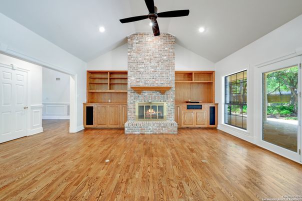 Empty room, Fireplace, Interior, Recessed Lighting, Stone Walls, Wood Texture Flooring