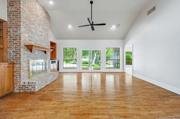 Empty room, Fireplace, Interior, Recessed Lighting, Stone Walls, Wood Texture Flooring