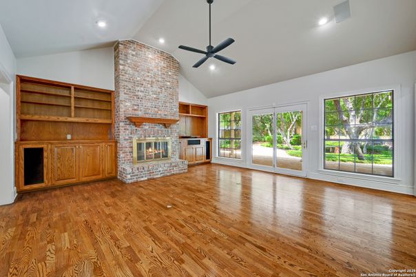 Empty room, Fireplace, Interior, Recessed Lighting, Stone Walls, Wood Texture Flooring