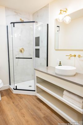 Bathroom, Glass Shower, Interior, Marble Walls, Wood Texture Flooring