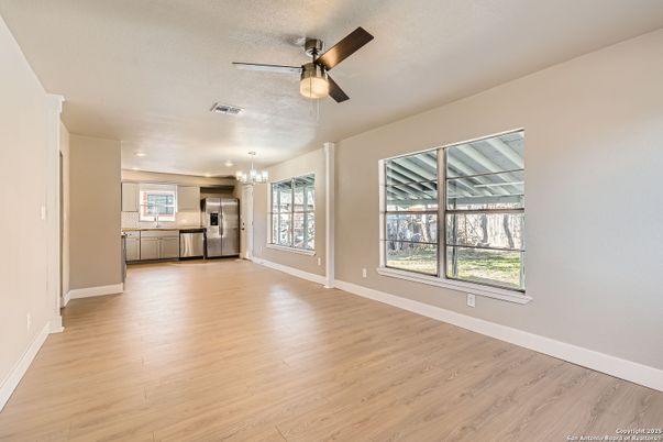Chandelier, Empty room, Interior, Kitchen, Recessed Lighting, Stainless Steel Appliances, Wood Texture Flooring