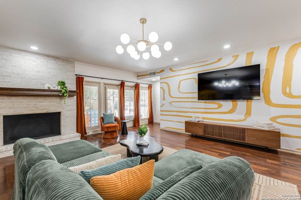 Fireplace, Interior, Living room, Pendant Lights, Recessed Lighting, Stone Walls, Wood Texture Flooring