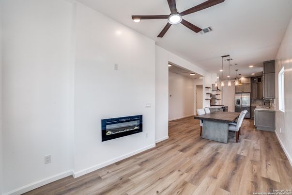Dining room, Interior, Kitchen, Pendant Lights, Recessed Lighting, Stainless Steel Appliances, Wood Texture Flooring