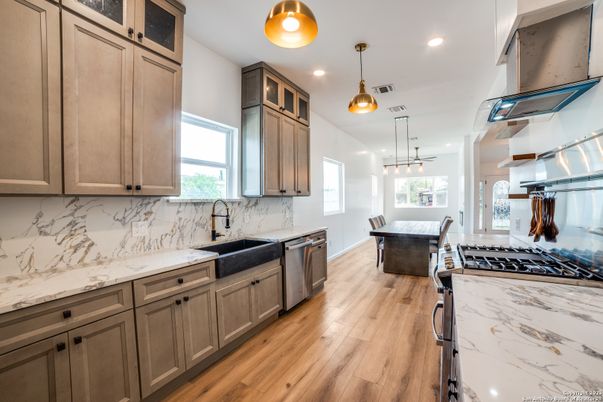 Dining room, Interior, Kitchen, Marble Walls, Pendant Lights, Recessed Lighting, Stainless Steel Appliances, Wood Texture Flooring