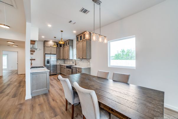 Dining room, Interior, Kitchen, Pendant Lights, Recessed Lighting, Stainless Steel Appliances, Wood Texture Flooring