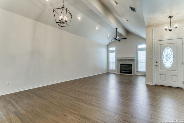 Chandelier, Empty room, Fireplace, Interior, Pendant Lights, Recessed Lighting, Wood Texture Flooring