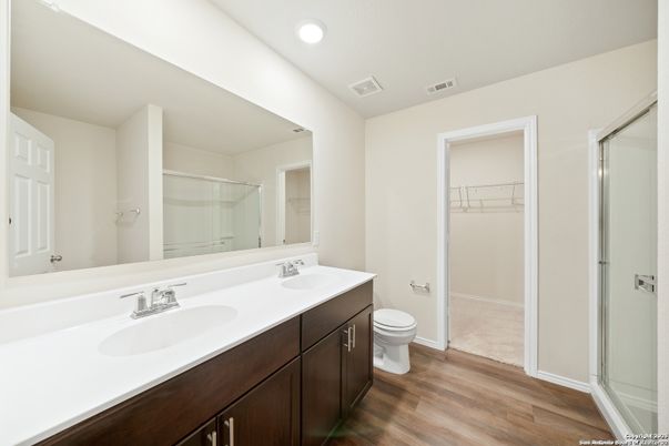 Bathroom, Dual Sink Vanities, Glass Shower, Interior, Recessed Lighting, Walk-in Closets, Wood Texture Flooring