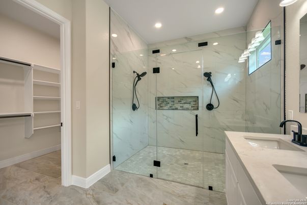 Bathroom, Dual Sink Vanities, Glass Shower, Interior, Marble, Marble Walls, Recessed Lighting