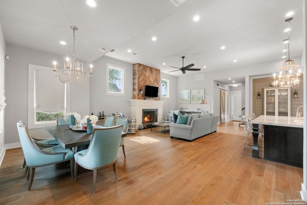 Chandelier, Dining room, Fireplace, Interior, Living room, Pendant Lights, Recessed Lighting, Wood Texture Flooring
