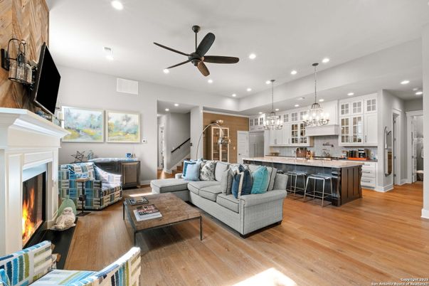 Chandelier, Fireplace, Interior, Kitchen, Living room, Pendant Lights, Recessed Lighting, Wood Texture Flooring