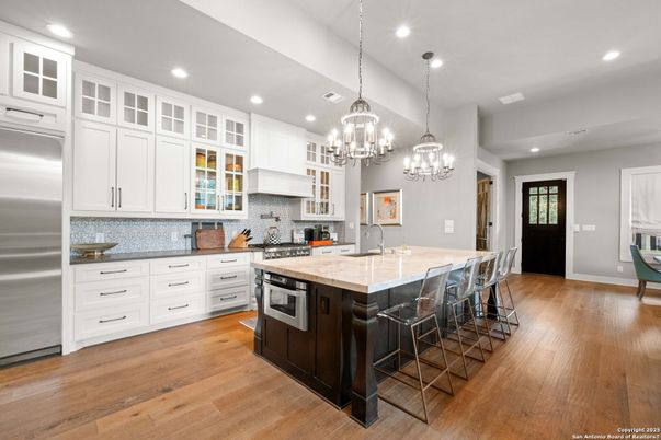 Chandelier, Interior, Kitchen, Pendant Lights, Recessed Lighting, Stainless Steel Appliances, Wood Texture Flooring