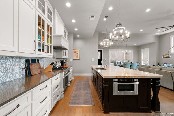 Chandelier, Dining room, Interior, Kitchen, Pendant Lights, Recessed Lighting, Stainless Steel Appliances, Wood Texture Flooring