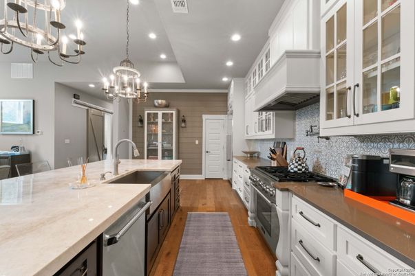 Chandelier, Interior, Kitchen, Pendant Lights, Recessed Lighting, Stainless Steel Appliances, Wood Texture Flooring