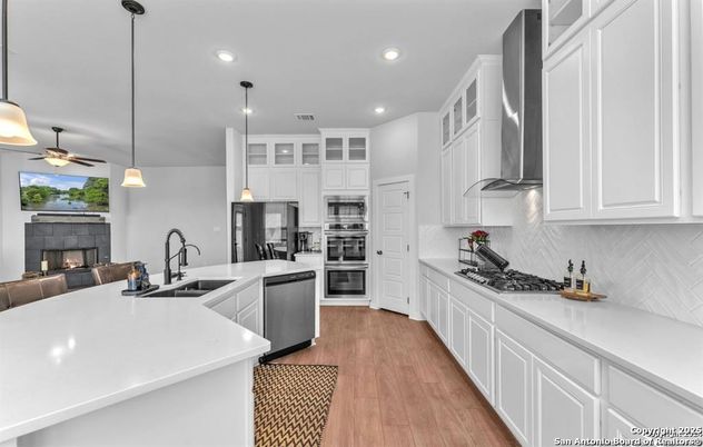Fireplace, Interior, Kitchen, Pendant Lights, Recessed Lighting, Stainless Steel Appliances, Wood Texture Flooring