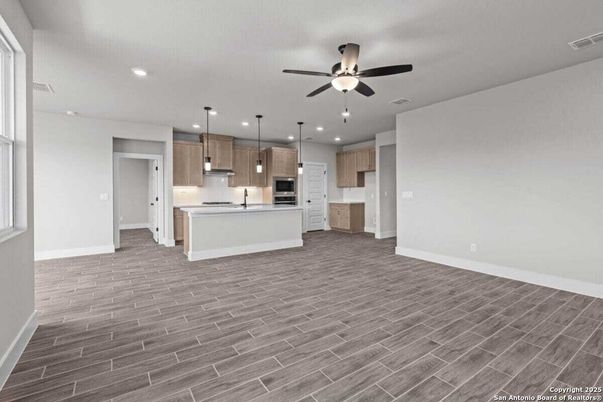 Empty room, Interior, Kitchen, Pendant Lights, Recessed Lighting, Stainless Steel Appliances, Wood Texture Flooring