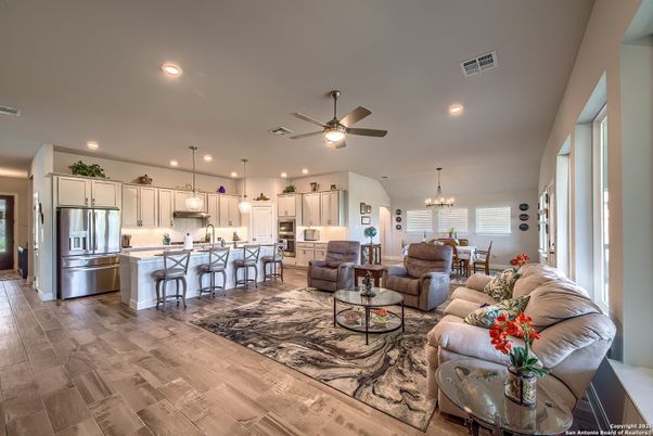 Chandelier, Dining room, Interior, Kitchen, Living room, Pendant Lights, Recessed Lighting, Stainless Steel Appliances, Wood Texture Flooring