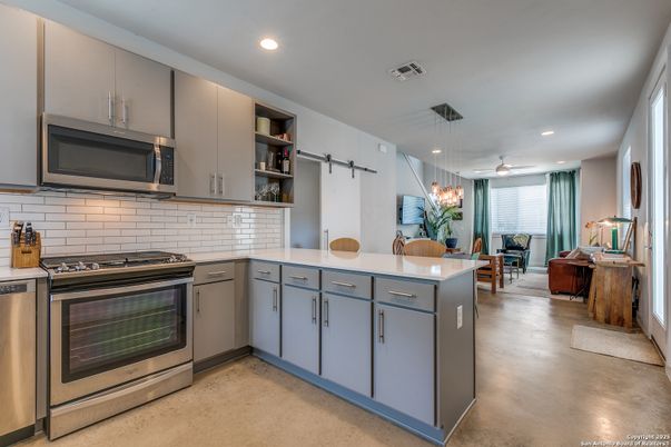 Dining room, Interior, Kitchen, Living room, Pendant Lights, Recessed Lighting, Stainless Steel Appliances, Wood Texture Flooring