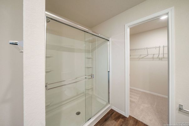 Bathroom, Glass Shower, Interior, Recessed Lighting, Walk-in Closets, Wood Texture Flooring