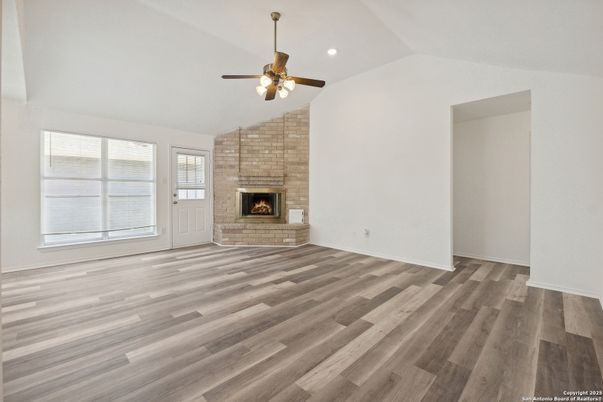 Empty room, Fireplace, Interior, Recessed Lighting, Stone Walls, Wood Texture Flooring