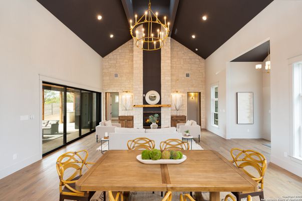 Chandelier, Dining room, Fireplace, Interior, Living room, Recessed Lighting, Stone Walls, Wood Texture Flooring