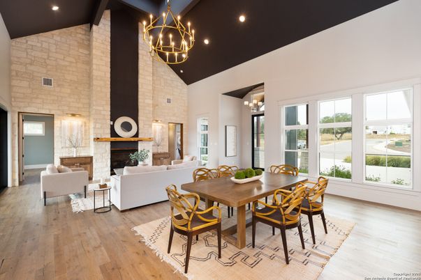 Chandelier, Dining room, Fireplace, Interior, Living room, Recessed Lighting, Stone Walls, Wood Texture Flooring