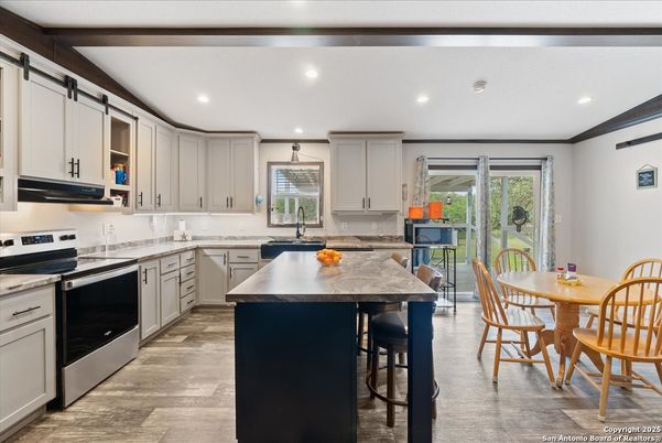 Dining room, Interior, Kitchen, Recessed Lighting, Stainless Steel Appliances, Wood Texture Flooring
