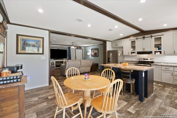Dining room, Interior, Kitchen, Living room, Recessed Lighting, Stainless Steel Appliances, Wood Texture Flooring