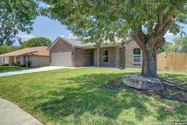 Attached, Backyard, Exterior, Facade, Brick Facade, Ranch