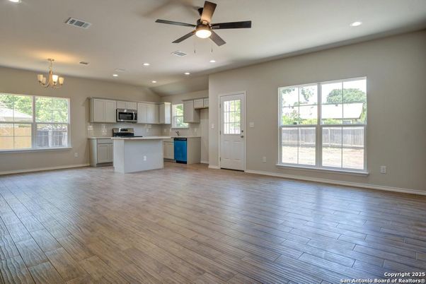 Chandelier, Empty room, Interior, Kitchen, Recessed Lighting, Stainless Steel Appliances, Wood Texture Flooring